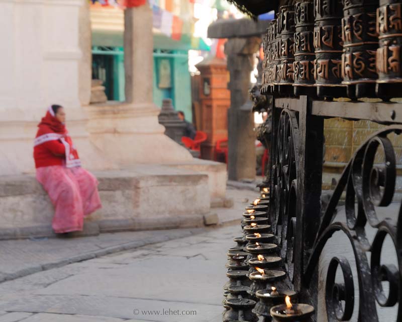 Woman in Red Shawl,Prayer Wheels