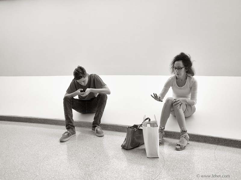 boy with phone, woman with hand, waiting for James Turrell at the Guggenheim